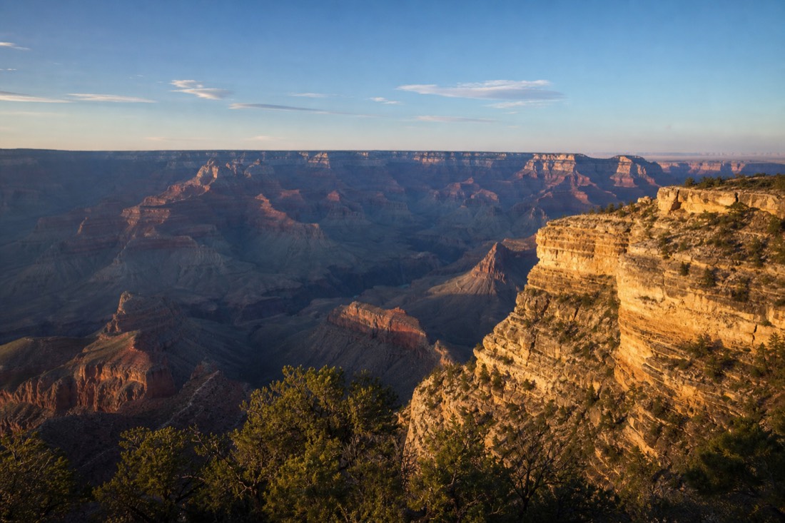 Crowd-free morning at a South Rim overlook with the canyon fully open under clear blue sky