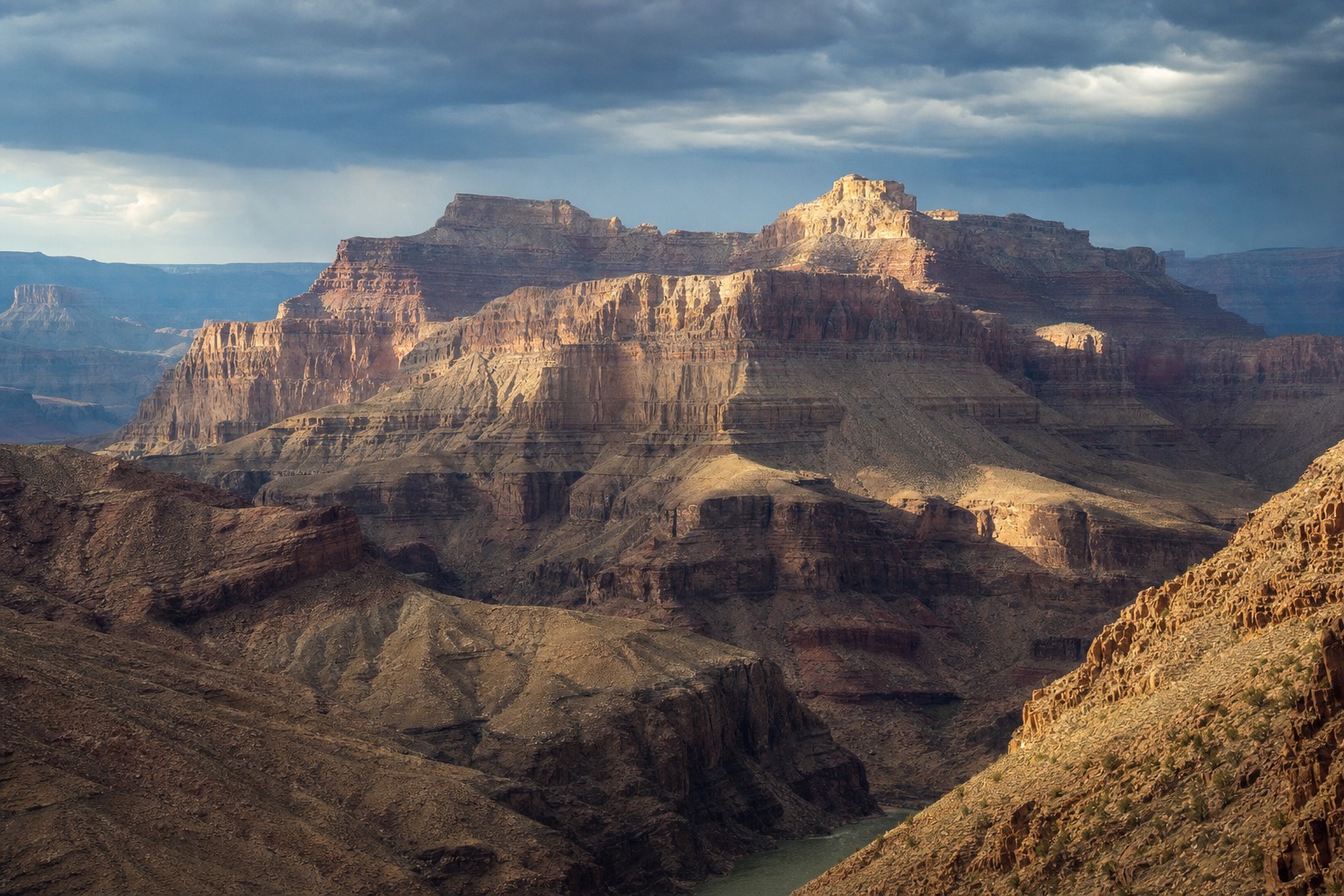Storm light over the deep gorges near the Colorado River confluence in the eastern Grand Canyon
