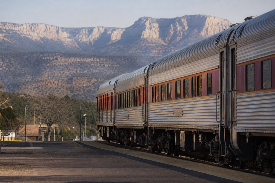 Vintage passenger railcars of the Grand Canyon Railway waiting at the Williams depot on a clear morning
